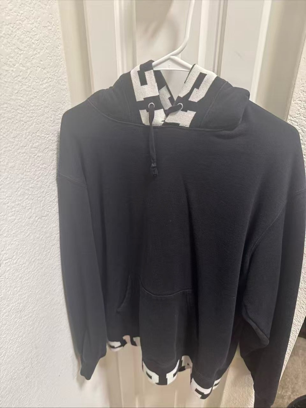 Supreme Black Hoodie with White Geometric Accents